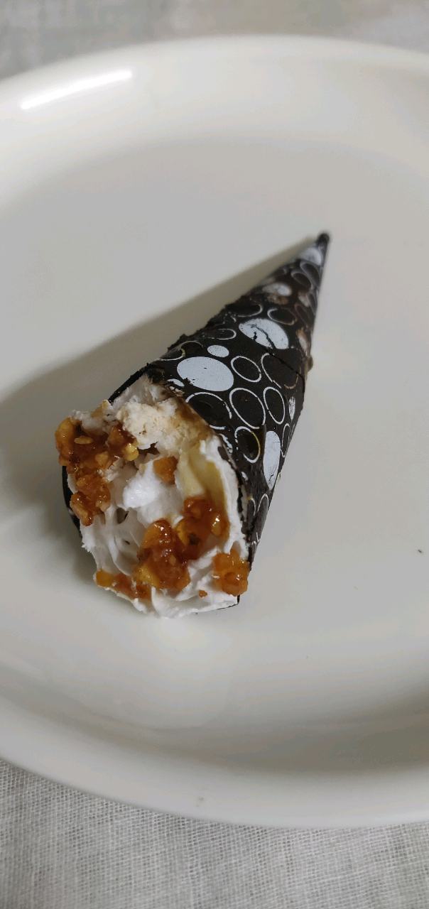 Chocolate Cone filled with eggless sponge, truffle and cream