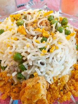 

 Gatta Pulao 

Pulao made with a fusion of peas & Rajasthani delicacy Gatte. The combination is quite unusual, but the aroma of spices & Gatte come out so well , that gives a very happy treat to eyes & our taste buds too. 
Do try this recipe you shall definitely enjoy the taste....... Thanks...
Here's the recipe.....
For the Gatte 
‌Take 1cup besan,add  3tsp oil, 1 tsp saunf , 1tsp Red chilli powder,salt to taste, knead into a soft dough.
Roll out it into logs. Boil them in water for 5 minutes.
Take them out & deep fry till golden brown.
For the peas Pulao 
Soak 1cup basmati rice in water, Now take 1tsp ghee in pan ,put 1tsp jira,1bay leaf,4-5 cloves,1 chopped onion,2 garlic cloves chopped finely,soaked rice ,1cup peas & 2 cups water, salt to taste .Add some Gatte also .Cook till rice is done.
Serve the Pulao & decorate it with the left fried Gatte . Serve hot.... Thanks 
Enjoy