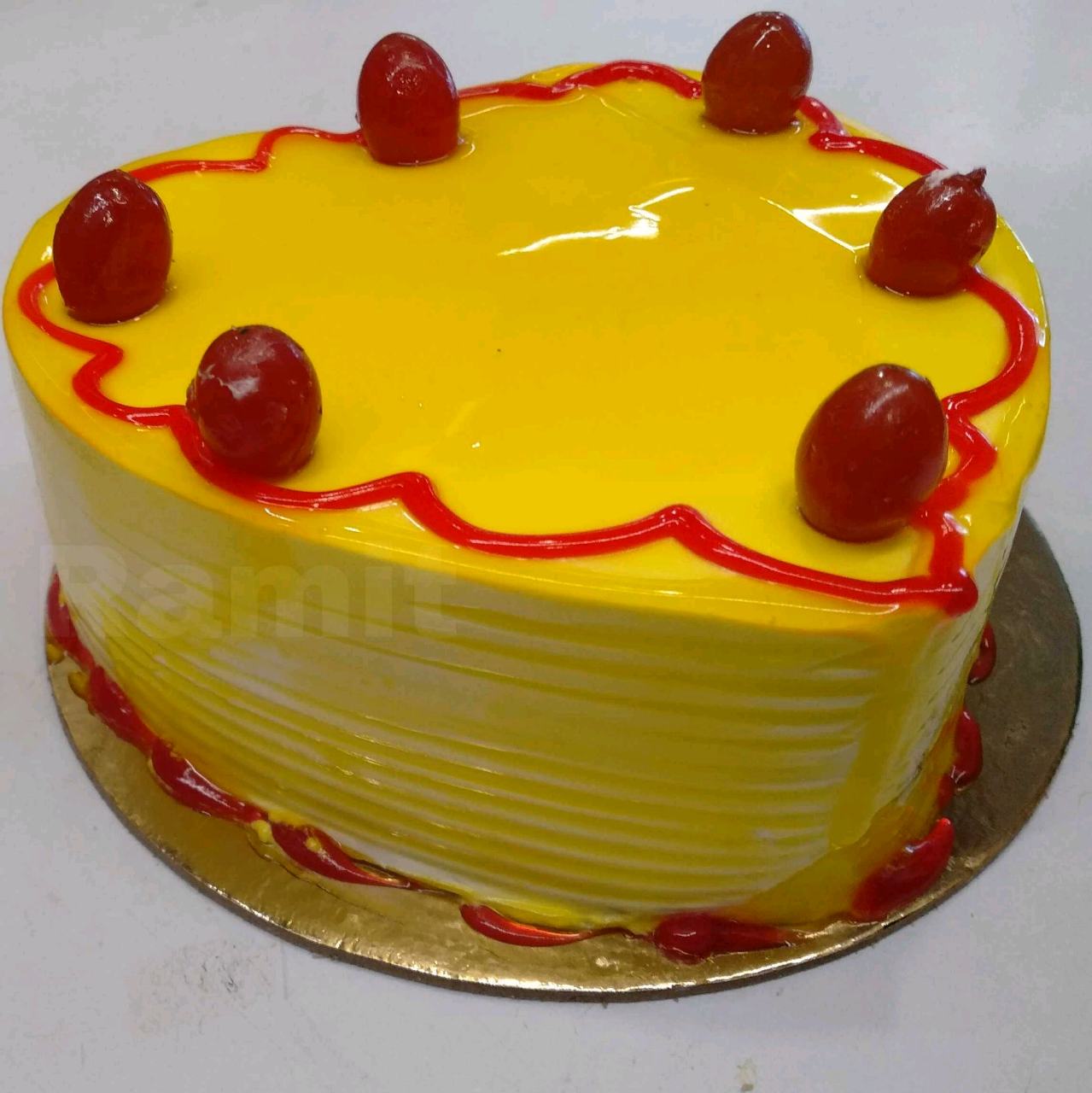 Pineapple Jelly Cake Topped With  Red Raspberry Jam