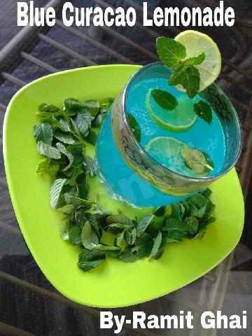 "Blue Curacao Lemonade".......Story behind making this Curacao Lemonade is that it's a yummy mocktail energy drink, can be served on any occasion, perhaps a new one among lemonade's..!
