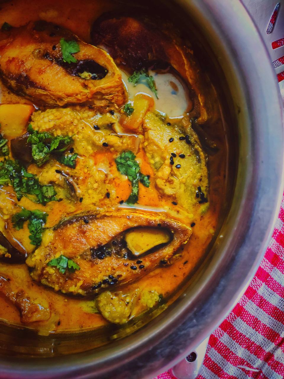 Ilish Or Hilsa Cooked With Aubergine In Mustard Gravy