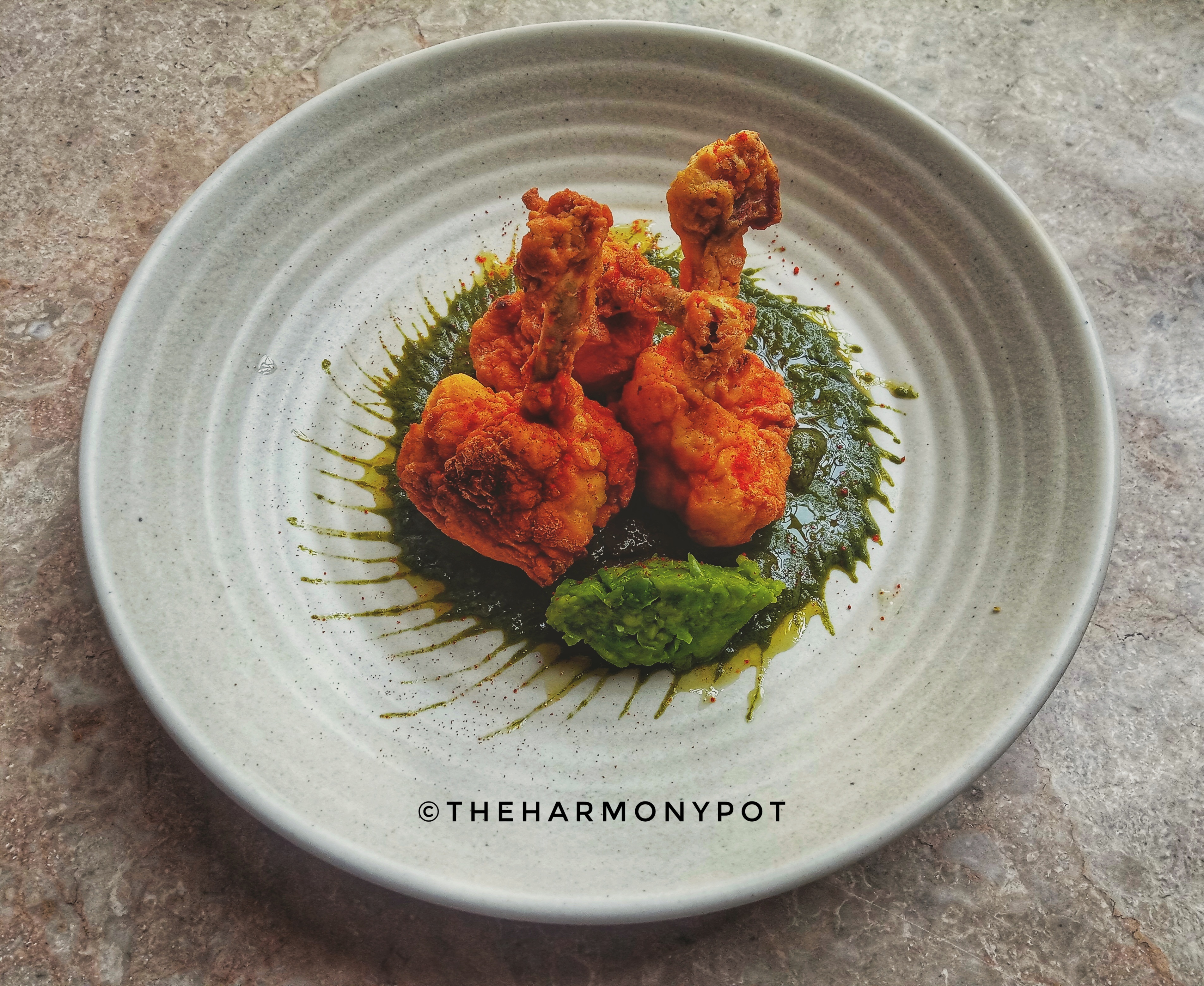 Crispy Chicken lollipops with Spinach Oregano Sauce and Green peas mint Mashed 