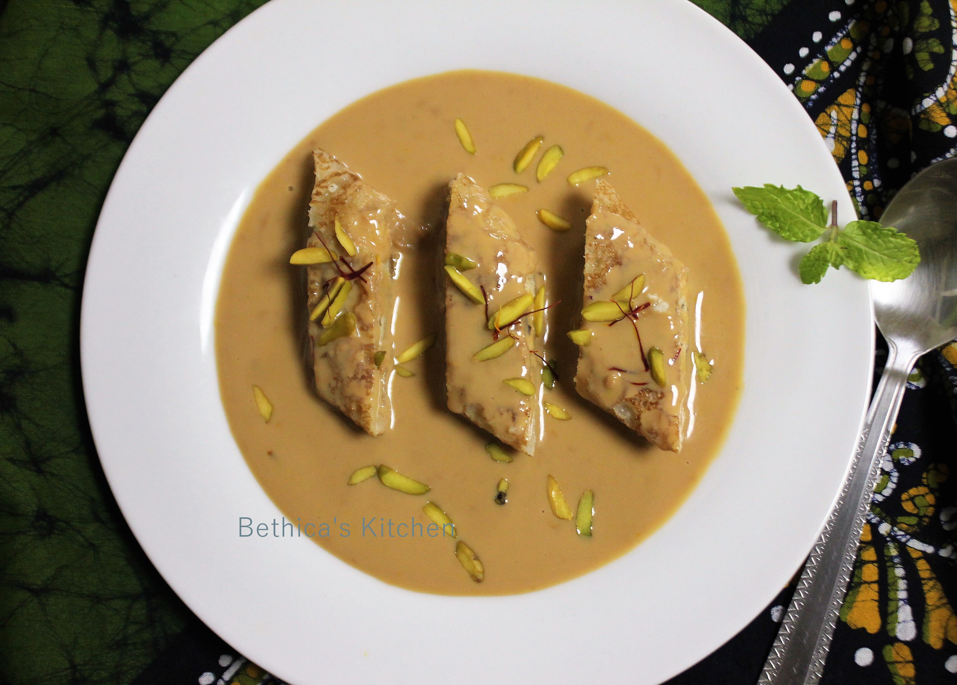 Patishapta Pithe in Caramelized Rabri (Traditional Bengali Dessert)